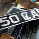 A photo of a black and silver number plate that reads "P50 CARS"